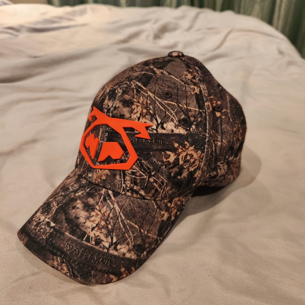 Nasty Pig Camo Baseball Cap with Orange Logo